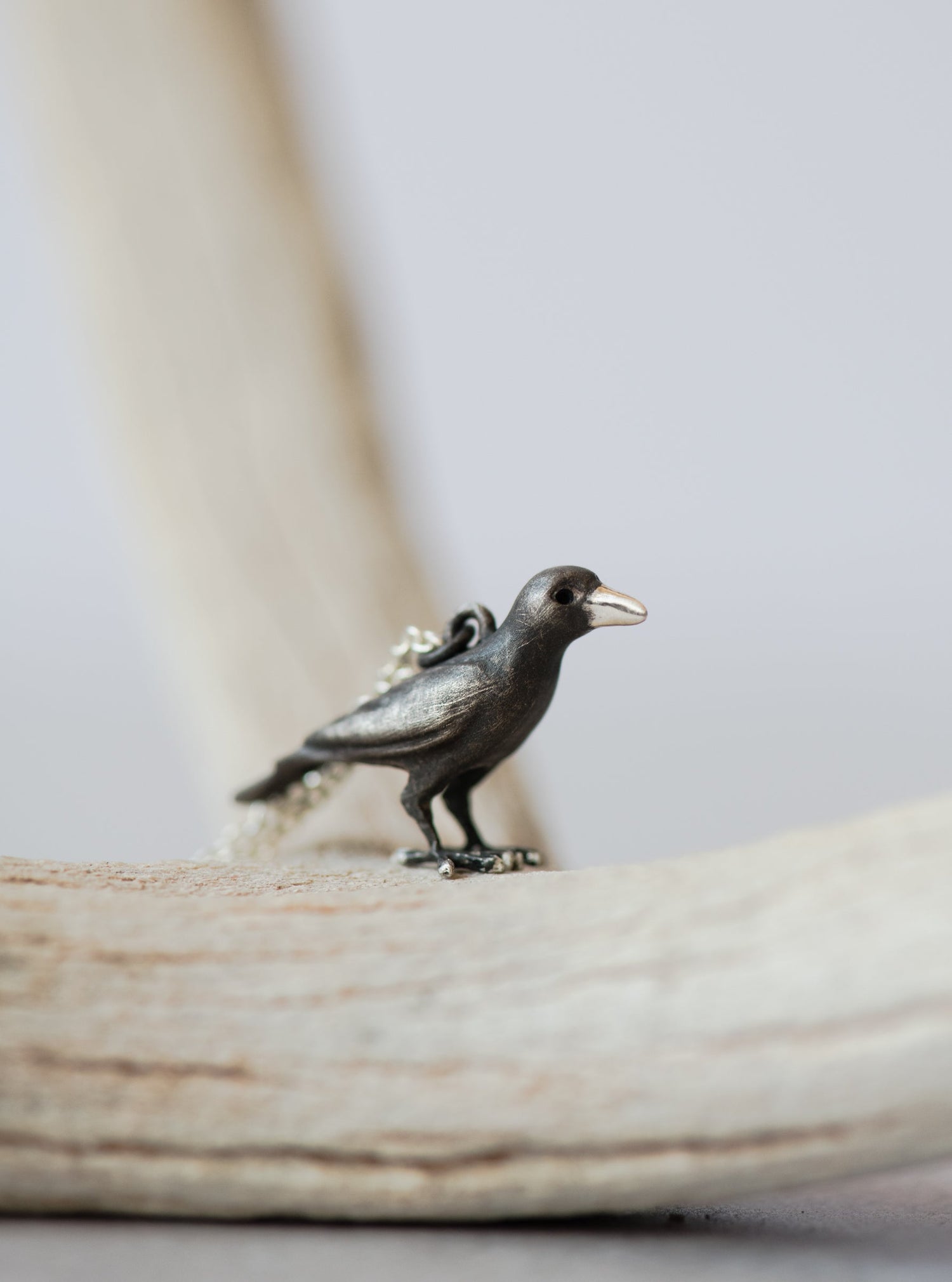 sterling silver raven on an antler